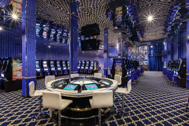 LAS VEGAS, USA - MAY, 2017: interior of elite luxury vip casino with rows of gambling slots machine in classic blue style color